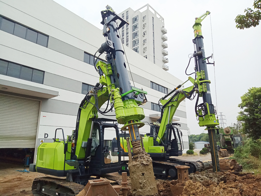 Máy đào đính kèm máy khoan gắn trên đá thủy lực để xây dựng không gian hẹp